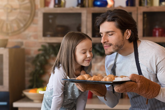 Father cooking with daughter.